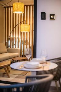 a living room with a table and a couch at Saladar Suites Boutique in Morro del Jable