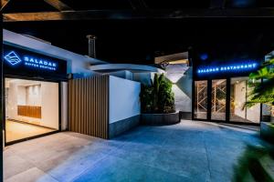 a store front at night with blue lights at Saladar Suites Boutique in Morro del Jable