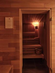 a sauna with stairs in a wooden wall at Casa Camper Berlin in Berlin