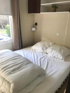 Katil atau katil-katil dalam bilik di Mobilhome confort