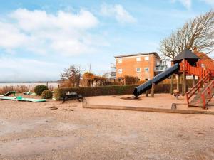 a playground with a slide at Hejlsminde ferie- og badeby in Hejls