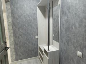a bathroom with a sink and a mirror at 1-ком апартаменты Comfort Plus Elita in Petropavlovsk