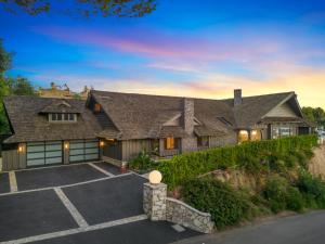 a large house with a driveway in front of it at Beverly Tree House in Los Angeles
