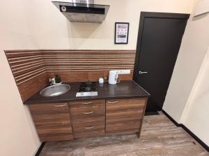 Kuchyň nebo kuchyňský kout v ubytování ApartHotel Riga