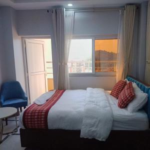 Postel nebo postele na pokoji v ubytování Buigal Bagan Restaurent & Apartment