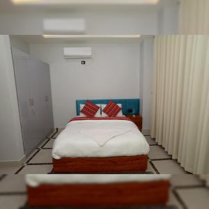 Postel nebo postele na pokoji v ubytování Buigal Bagan Restaurent & Apartment