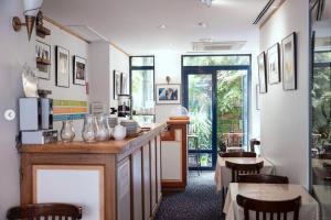 a kitchen with a counter and a table and chairs at Solar Hotel in Paris