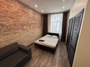 Postel nebo postele na pokoji v ubytování ApartHotel Riga