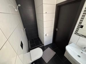 Koupelna v ubytování ApartHotel Riga