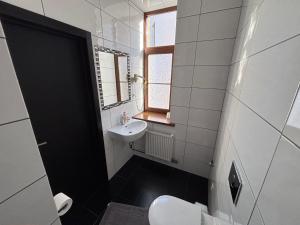 Koupelna v ubytování ApartHotel Riga