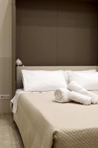 Postel nebo postele na pokoji v ubytování Parva Domus Bari