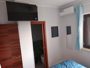 a room with a flat screen tv on a wall at Interamna Dreams in Pignataro Interamna
