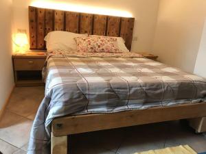 Postel nebo postele na pokoji v ubytování Chalet Rustico Bertolini per Gruppi!