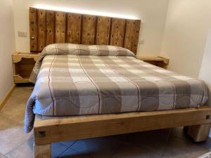 Postel nebo postele na pokoji v ubytování Chalet Rustico Bertolini per Gruppi!