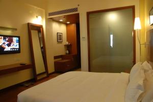 Ein Bett oder Betten in einem Zimmer der Unterkunft The Sky Imperial, Jaipur