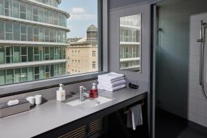 a bathroom with a sink and a window at Casa Camper Berlin in Berlin