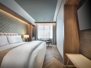 Postel nebo postele na pokoji v ubytování The Westin Madrid Cuzco