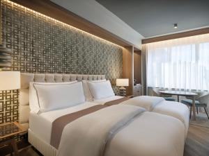 Postel nebo postele na pokoji v ubytování The Westin Madrid Cuzco