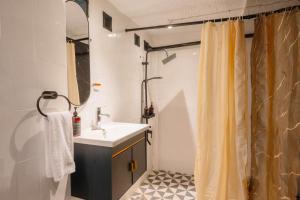 a bathroom with a sink and a shower at CBD Studio3 next to Sun Plaza Real City Center! in Medan