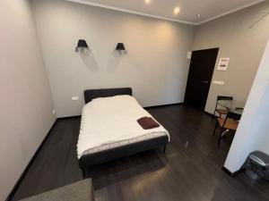 Postel nebo postele na pokoji v ubytování ApartHotel Riga