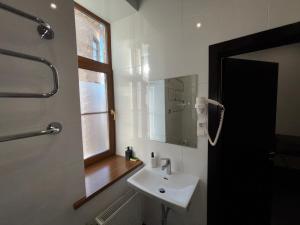 Koupelna v ubytování ApartHotel Riga