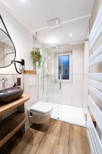 a bathroom with a shower and a toilet at Haus Tonburg - RoLigio-Campus in Bad Sachsa +42 photos