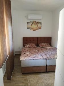 Postel nebo postele na pokoji v ubytování Apartmani Studio