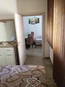 Postel nebo postele na pokoji v ubytování Apartmani Studio