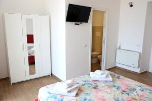 Postel nebo postele na pokoji v ubytování Antares Rooms