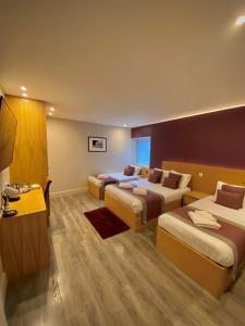 Postel nebo postele na pokoji v ubytování Holtwhites Hotel