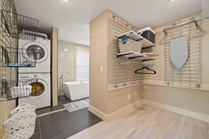 a laundry room with a washer and dryer in it at Farmhouse 1918 Grand Retreat for 12 people with Lake Views in Boyne City +67 photos