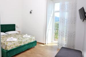 Postel nebo postele na pokoji v ubytování Antares Rooms