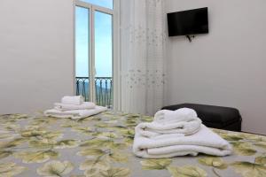 Postel nebo postele na pokoji v ubytování Antares Rooms