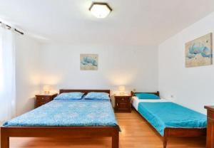 Postel nebo postele na pokoji v ubytování Apartment Kosta