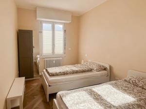 Postel nebo postele na pokoji v ubytování Casa Fortuna - erste Seelage - fantastischer Seesicht - alles fussläufig erreichbar