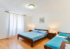 Postel nebo postele na pokoji v ubytování Apartment Kosta