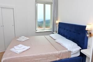 Postel nebo postele na pokoji v ubytování Antares Rooms