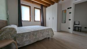 Postel nebo postele na pokoji v ubytování Agriturismo Ai Tre Fienili + 32 fotografií