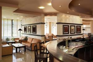a lobby with a bar and a waiting room at Hotel Orphey in Bansko