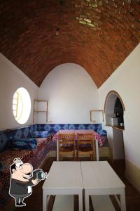 a room with a table with a cartoon pig with a camera at Ibiza Guest House in Aswan +43 photos