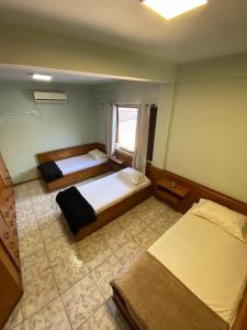 Triana Guest House客房内的一张或多张床位