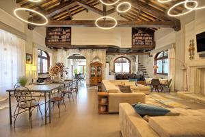 a large living room with a table and chairs at Villa Tagliaferri by PosarelliVillas in Vasto