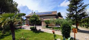 a house with solar panels on the roof at Villa Tagliaferri by PosarelliVillas in Vasto
