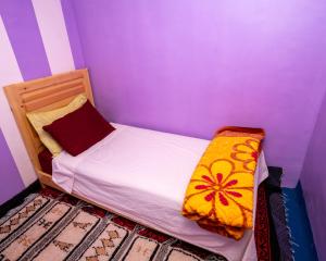 Uma cama ou camas num quarto em Gite Tamounte