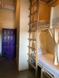 Postel nebo postele na pokoji v ubytování Teiú Hostel Trancoso
