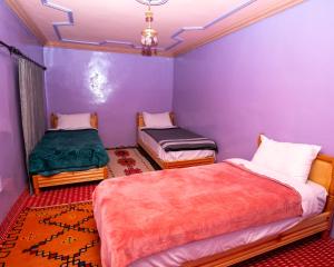 Uma cama ou camas num quarto em Gite Tamounte