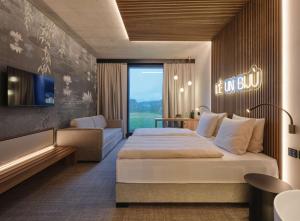 Postel nebo postele na pokoji v ubytování Dorint Resort & Spa Locarno-Riazzino - New Opening + 24 fotografií