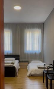 Postel nebo postele na pokoji v ubytování Hotel Rubin