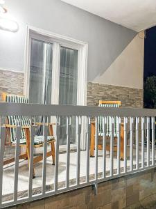 a balcony with rocking chairs and a balcony railing at Angel's Home in Somma Vesuviana