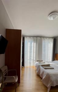 Postel nebo postele na pokoji v ubytování Hotel Rubin